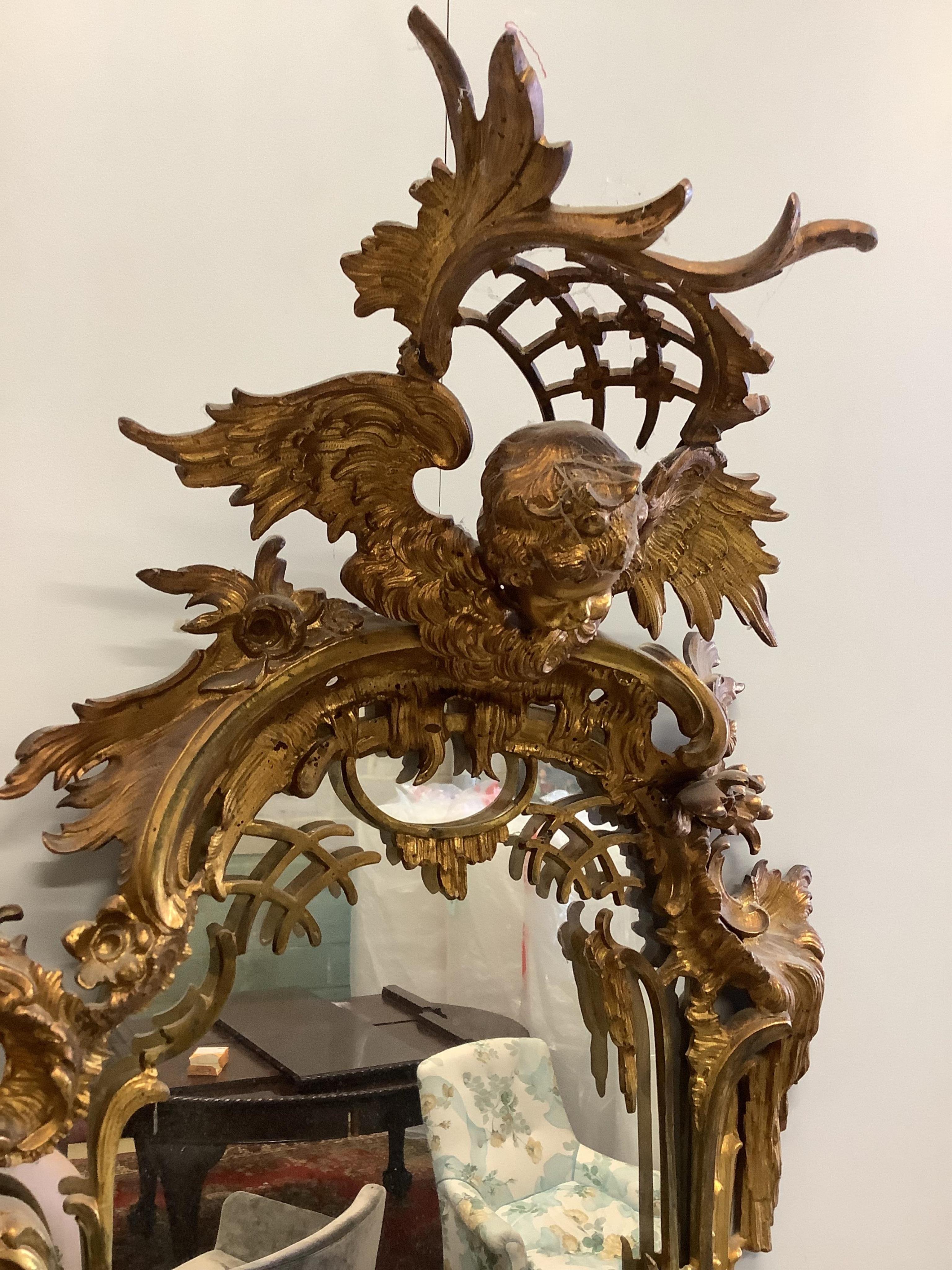 A Chippendale Revival gilt metal wall mirror, width 35cm, height 74cm. Condition - good